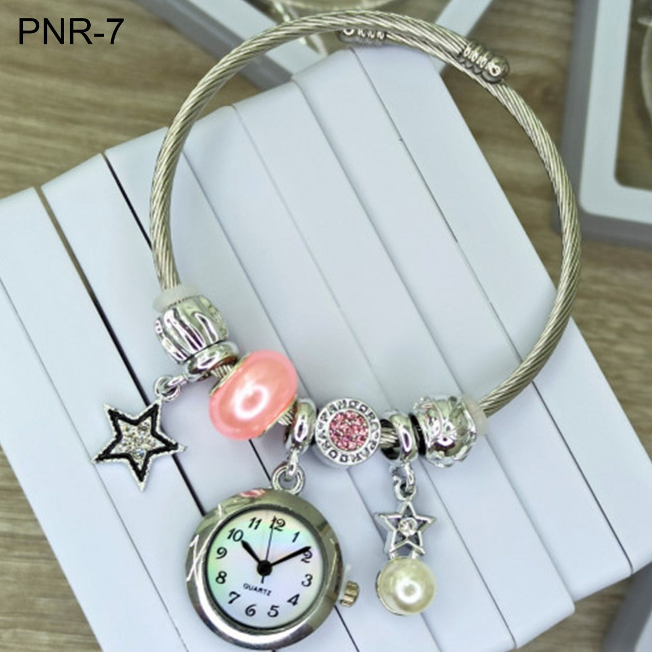 HERMOSO RELOJ PARA DAMA TIPO PULSERA CON DIJES INCLUIDOS